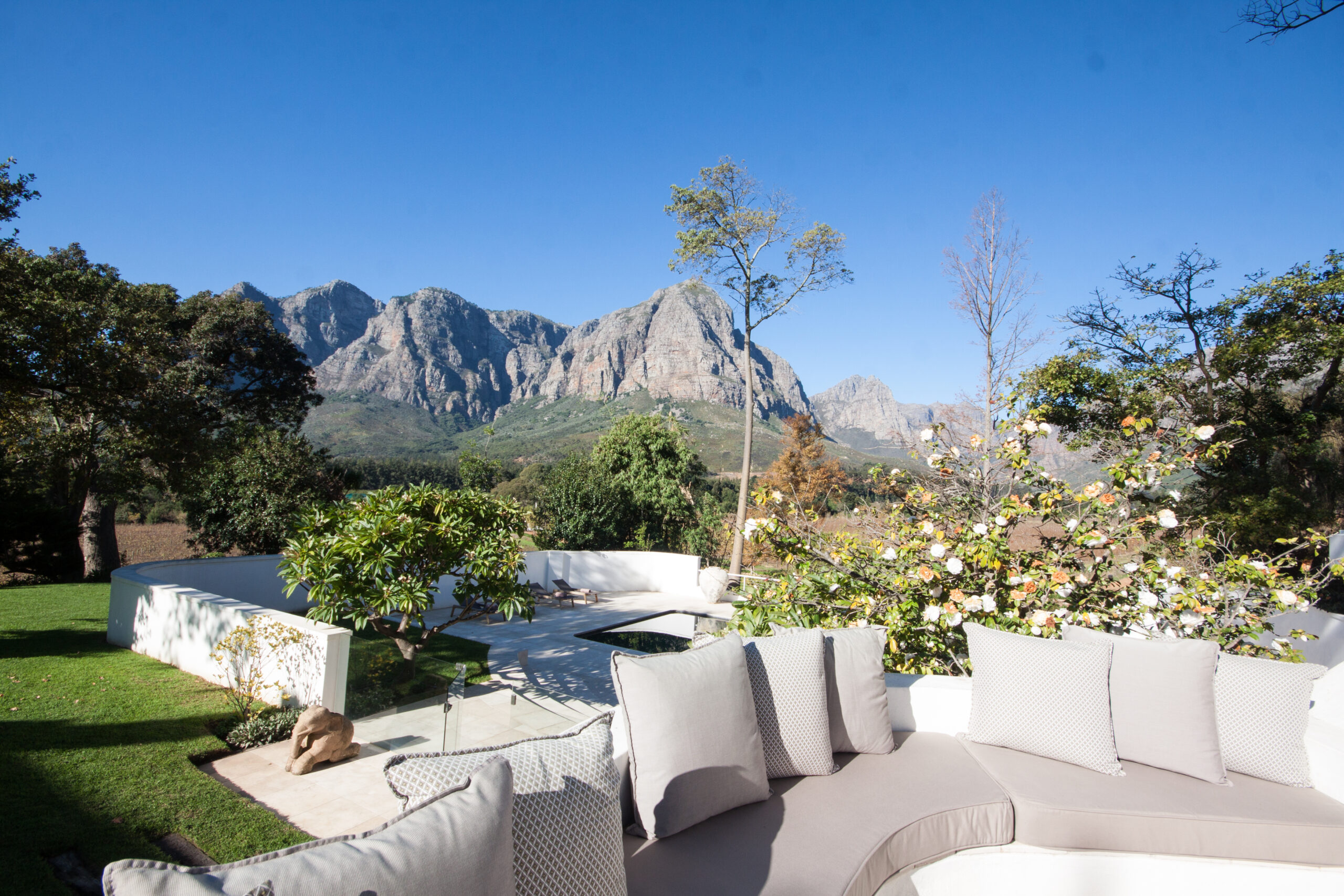 Braai Patio Lounging Corner With View Of Pool Area And Surrounding Mountains
